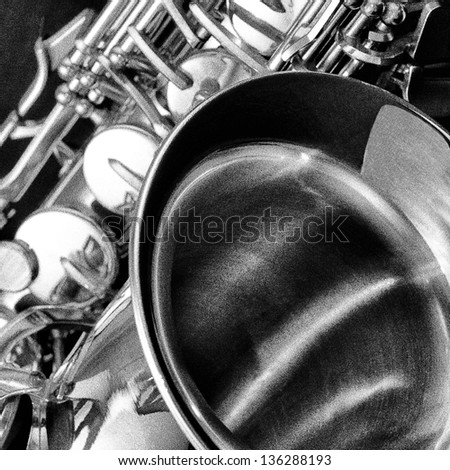 Saxophone instrument in black and white with pointillism film grain effect