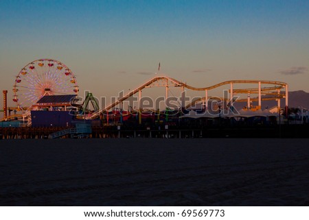 Santa Monica Pier Amusment Park Ferris Wheel and Roller Coaster at Sunrise