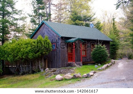 Rustic cabin sits along the path on a beautiful spring day