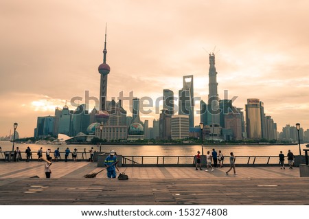 SHANGHAI, CHINA - AUGUST 3: Early morning photographers are out to photograph the Shanghai skyline on August 3, 3013 in Shanghai, China.