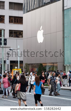 TOKYO, JAPAN - SEPTEMBER 22: Shoppers and tourists pass by a large Apple store in Ginza on September 22, 2013 in Tokyo, Japan.