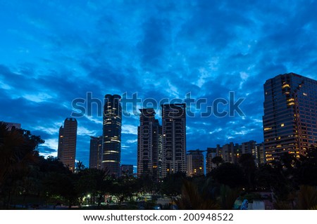 The sun rises over the skyscrapers of Kuala Lumpur.