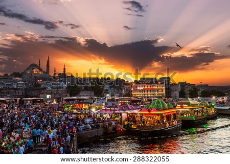 ISTANBUL, TURKEY - JULY 29: Hundreds of tourists and local Turks hang out along the Bosphorus as night comes on on July 29, 2014 in Istanbul, Turkey.