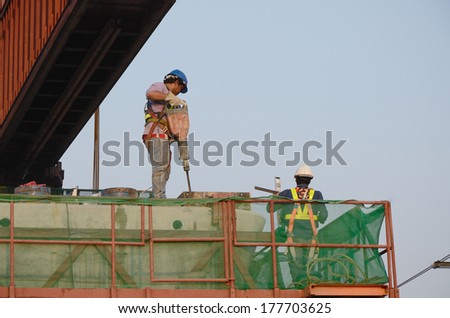 BANGKOK, THAILAND - FEB 19: Unidentified workers under construction at Sky Train Blue line phetkasem 48 station on 19 February 2014 at Phetkasem road soi 48, Bangkae district, Bangkok