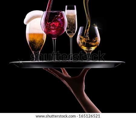 tray with different drinks on black background - champagne, beer, cocktail, wine, brandy, whiskey, scotch, vodka, cognac