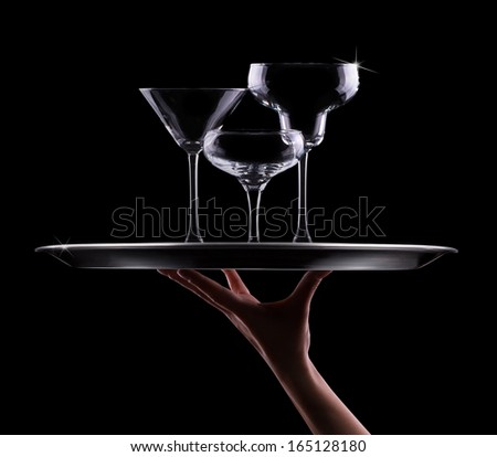 tray with different empty stemware on black background - champagne, beer, cocktail, wine, brandy, whiskey, scotch, vodka, cognac