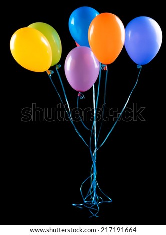flying balloons isolated on a black background