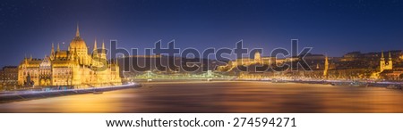 View of hungarian Parliament building and Liberty Statue at night in Budapest, Hungary