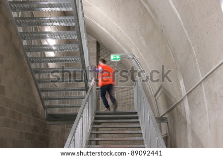 A motion blur abstract of a person walking ok the fire escape