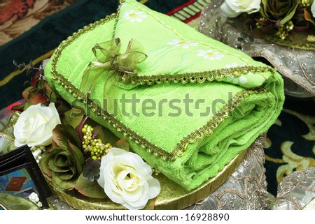 A towel folded to appear like a handbag. It will be presented as a gift in a Malay wedding in Malaysia.