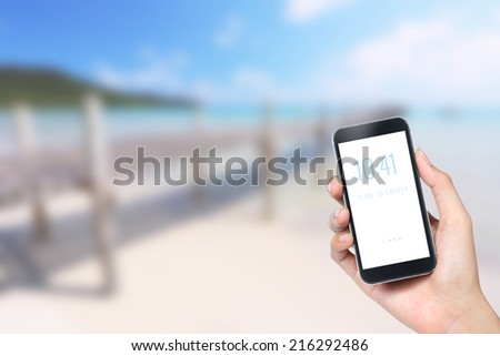 mobile phone with beach background