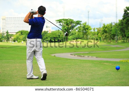 man swing golf club in nice golf range-outdoor.