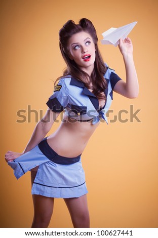 beautiful flight attendant in a retro pin up style
