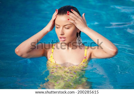 fashion portrait of beautiful and sexy women in ocean