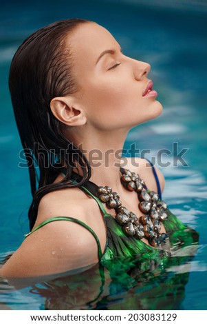 fashion portrait of beautiful and sexy women in ocean