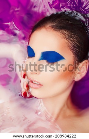 Attractive woman in water with glamor make-upAttractive woman in water with glamor make-up