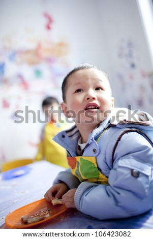Asian boy learning the painting in the classroom,shanghai,china