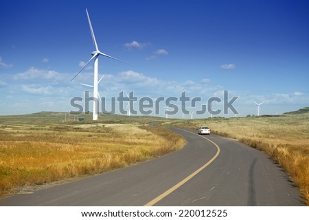 Wind farm at farmland against blue sky,north China