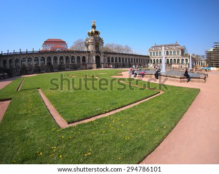 Dresden, Germany - April 23, 2015: Courtyard Zwinger with paths, lawns, tourists and wide angle distortion view