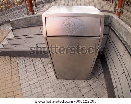Metal container for trash on the street with wide angle distortion view