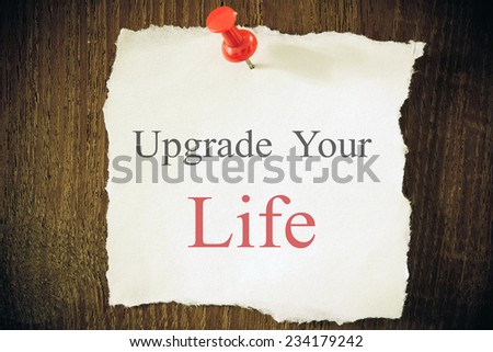 The phrase Upgrade Your Life typed on a piece of paper