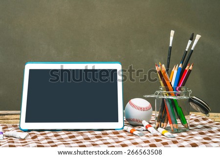 tablet pc and colored pencils