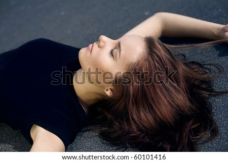 Beautiful healthy Young Woman lying on the grown