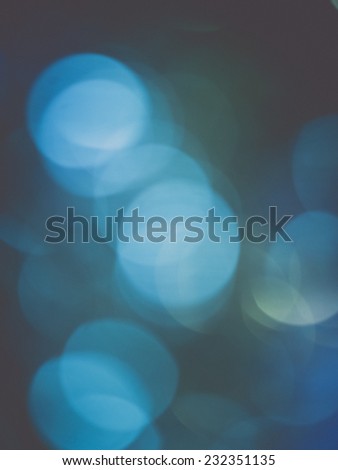 Abstract Festive background. Christmas and New Year feast bokeh background with copyspace. Holiday party background with blurry boke special magic effect.. Vintage effect.