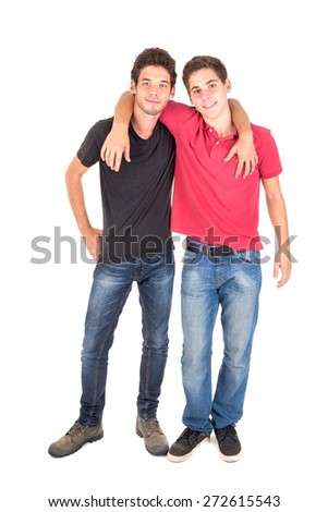 Happy teenage brothers hugging isolated in white