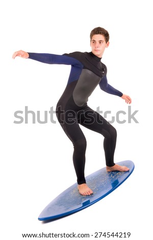 Teenager in wet suit with skimboard posing isolated in white