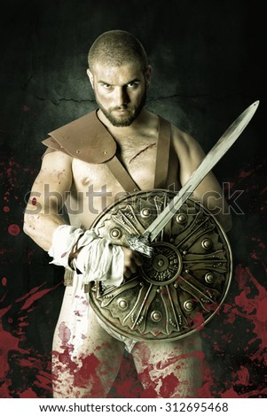 Gladiator posing with shield and sword in a dark background with blood
