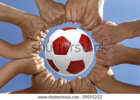 Several Hands Holding Together In A Circle Around A Soccer Ball Stock ...