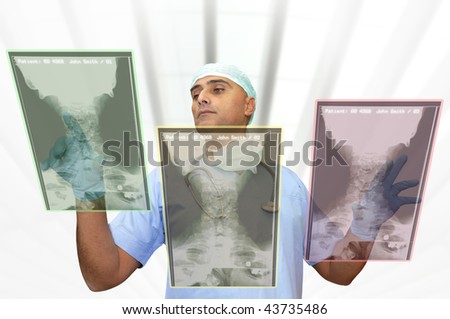 Doctor with high-tech computer screen viewing patient data