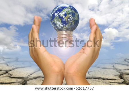 Hands with earth lightbulb  over a dry soil and sky background
