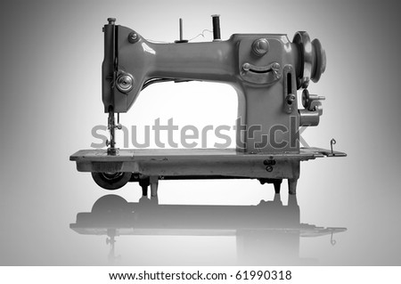 Old sewing machine isolated in a light background