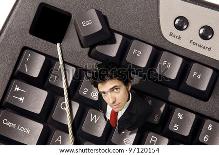 Businessman out of the  Escape key in a computer keyboard