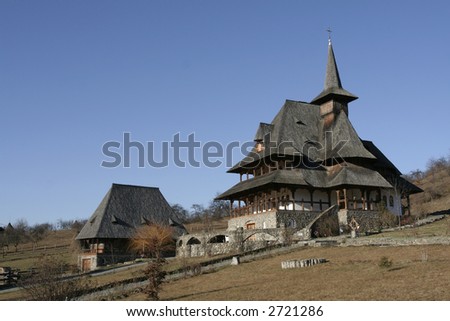 Wooden buildings on a orthodox monastery and the monastery park