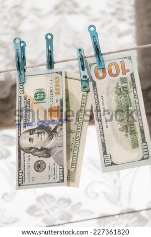 Money drying on the clothesline. The concept of money laundering