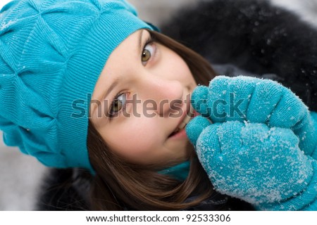 young girl warms frozen hands your breath