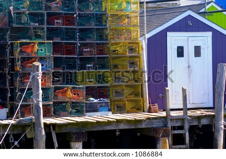 A cartoon-like mix of colors found on a fishing pier in Maine featuring colorful buildings and lobster traps.