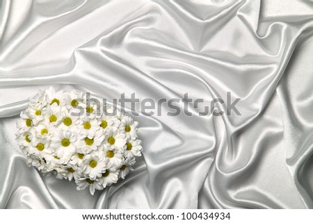 white daisies on a white satin