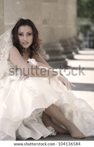 stylish portrait of a bride in theater columns