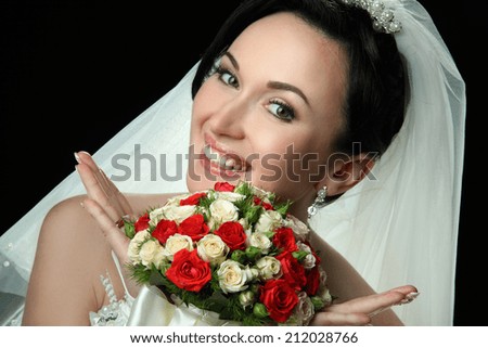beautiful bride with a wedding bouquet of flowers. portrait with bouquet. happy smile.