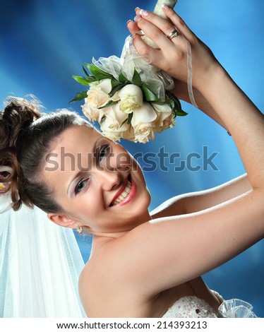 beautiful bride with a wedding bouquet of flowers. portrait with bouquet. happy smile.