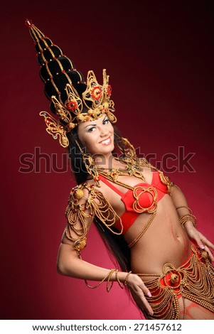 beautiful girl dressed like a Thai dancer. dance moves. beautiful colorful costumes, vivid emotions