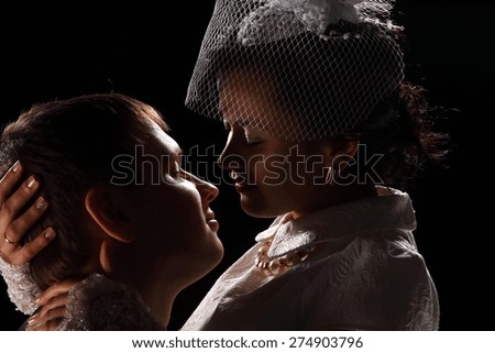 loving couple in a kiss against a dark background. love. family