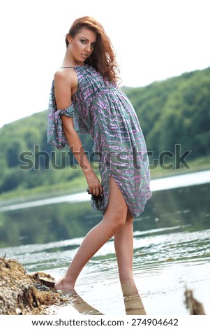 beautiful girl by the lake. good shape, bright emotions.