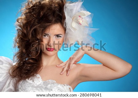 portrait of a young woman, stylish hairstyle, make-up art, studio photos, interesting image
