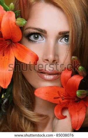 beautiful woman face with bright flowers