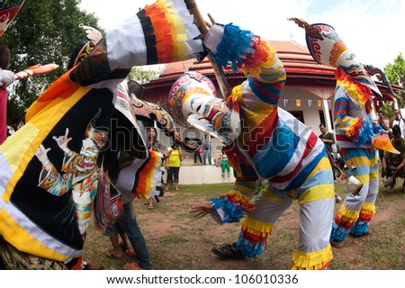 LOEI, THAILAND - JUNE 23: Phi Ta Khon Festival ( Traditional ghost mask festival ) Young people dress in spirit and wear a mask, sing and dance  on June 23,2012 in Loei Province,Thailand.